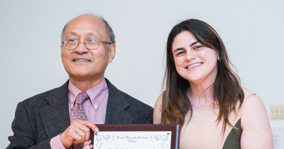 Image of Dylan O'Donoghue receiving her award from Dr. Teck-Kah Lim
